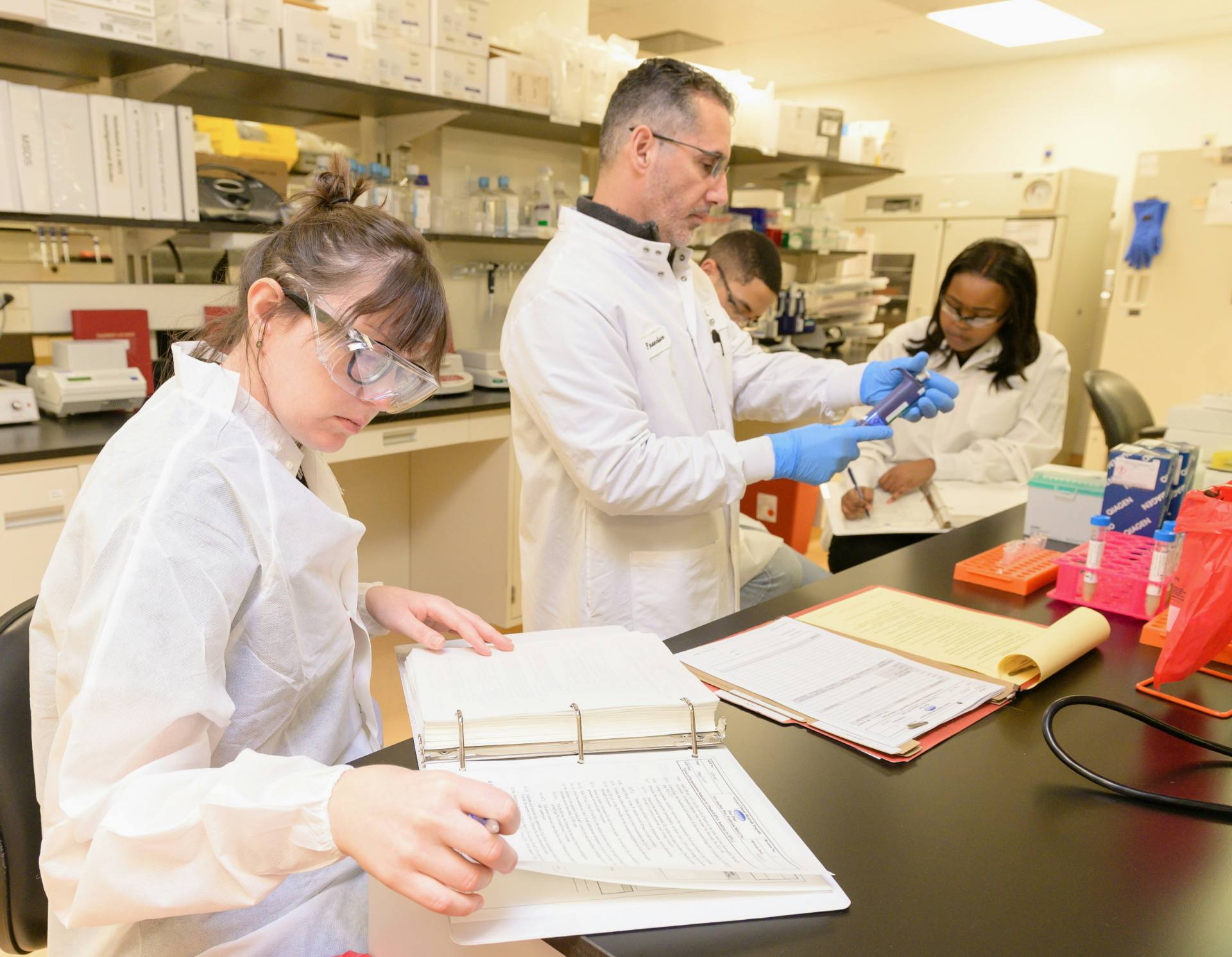 Scientists reviewing test data in a chemical laboratory