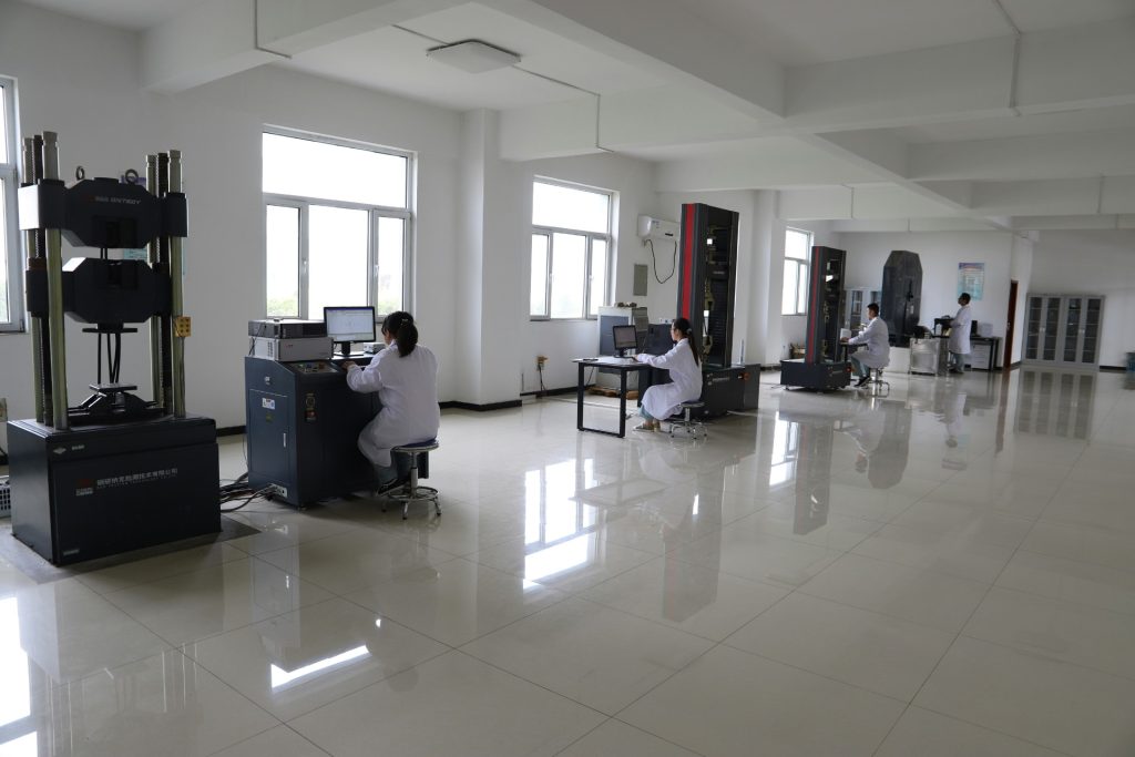 Scientists working with analytical equipment in a chemical testing laboratory